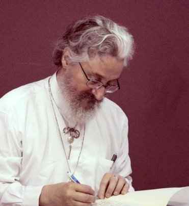 Isaac signing one of his books